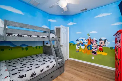 a bedroom with a mickey mouse mural on the wall at Free Waterpark|Game Room|Near Dis! in Orlando