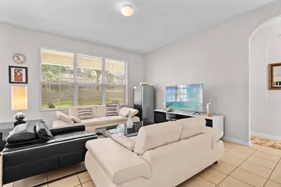 a living room with two couches and a tv at Large house at Windsor Hills Resort in Orlando