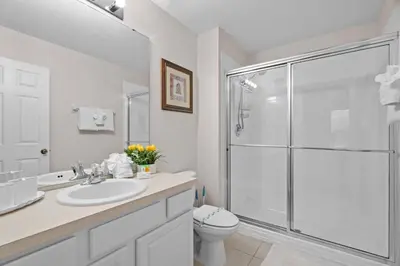 a bathroom with a shower and a sink and a toilet at Large house at Windsor Hills Resort in Orlando