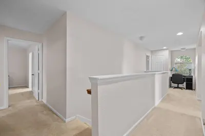 an empty room with white walls and a hallway at Large house at Windsor Hills Resort in Orlando