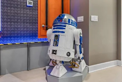 a star wars robot is on display in a room at Brand NEW 11 Bedrooms At Sonoma in Kissimmee