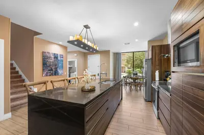 a kitchen with a large island in the middle at Magic Getaway 4 En-suites, BBQ & Near Parks in Orlando