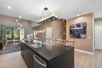 a kitchen with a black counter top in a room at Magic Getaway 4 En-suites, BBQ & Near Parks in Orlando