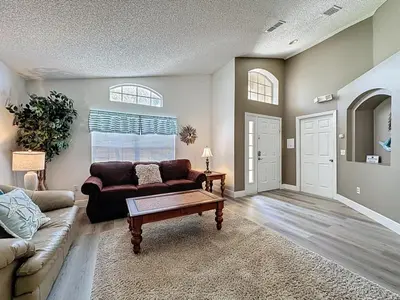 a living room with a couch and a coffee table at Terra Verde Resort 4 Bed Pool Spa Villa villa in Kissimmee