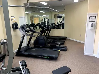 a row of exercise bikes in a gym at Cozy Kissimmee Hideaway in Kissimmee