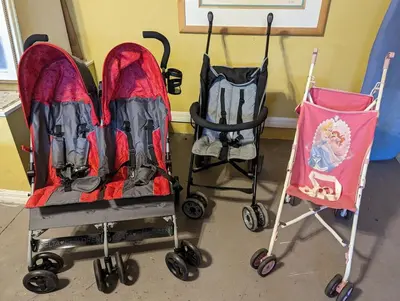 two strollers sitting next to each other in a room at Private Pool Villa, 3mi to Disney with Game Room in Kissimmee