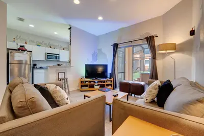 a living room with two couches and a tv at Disney Family Fun at Regal Oaks in Orlando