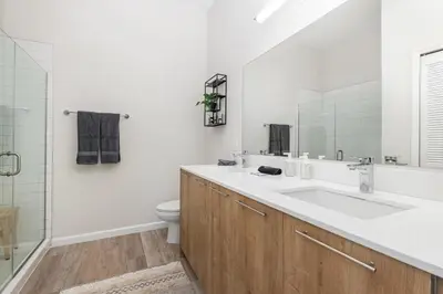 a white bathroom with a sink and a toilet at Orlando 2BR Mins to Universal and More in Orlando