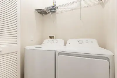 a white laundry room with a washer and dryer at Orlando 2BR Retreat 3 Beds Near Disney&Universal in Orlando