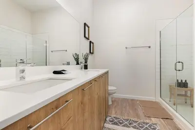 a white bathroom with a sink and a toilet at Orlando 2BR Retreat 3 Beds Near Disney&Universal in Orlando