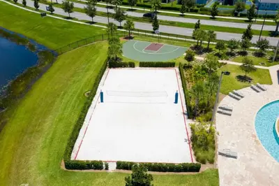 an overhead view of a tennis court next to a pool at Casa 5Q c/ Piscina e Temas Disney — Storey Lake in Kissimmee