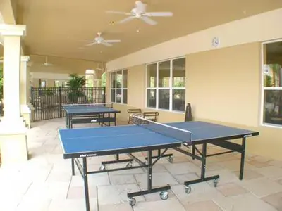 two ping pong tables sitting in a room with at Windsor Castle in Orlando