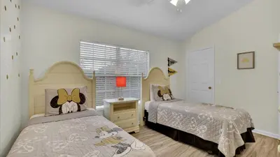 a bedroom with two beds and a window at SKC7679 Windsor Hills Resort Vacation Townhome in Orlando