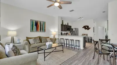 a living room with a couch and a table at SKC7679 Windsor Hills Resort Vacation Townhome in Orlando