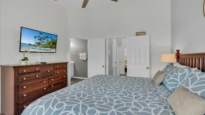 a bedroom with a bed and a dresser and a tv at SKC7679 Windsor Hills Resort Vacation Townhome - includes resort clubhouse amenity access in Orlando