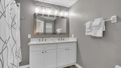 a bathroom with a white sink and a mirror at SKC7679 Windsor Hills Resort Vacation Townhome - includes resort clubhouse amenity access in Orlando