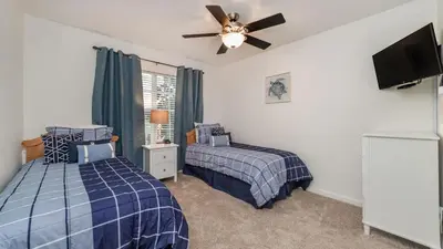 a bedroom with two beds and a ceiling fan at MNL2683 - Windsor Hills Resort Vacation Home - includes resort clubhouse amenity access in Orlando
