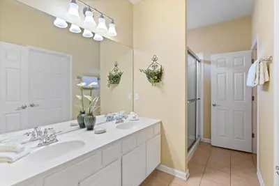 a bathroom with two sinks and a large mirror at PW2605 Windsor Hills Resort Vacation Home - includes resort clubhouse amenity access in Orlando
