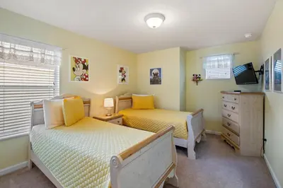 a bedroom with two beds and a dresser at PW2605 Windsor Hills Resort Vacation Home - includes resort clubhouse amenity access in Orlando