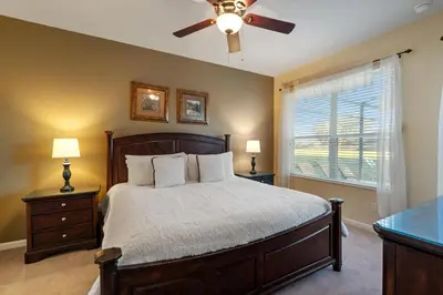 a bedroom with a bed and a ceiling fan at PW2605 Windsor Hills Resort Vacation Home in Orlando