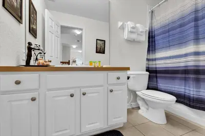 a bathroom with a sink and a toilet and a shower at MNL2702 Windsor Hills Resort Vacation Home - includes resort clubhouse amenity access in Orlando