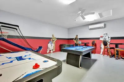 a play room with a ping pong table and a net at MNL2702 Windsor Hills Resort Vacation Home in Orlando