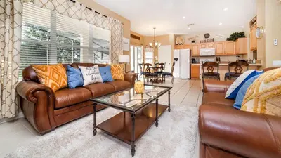 a living room with a couch and a table at MNL2696 Windsor Hills Resort Vacation Home - includes resort clubhouse amenity access in Orlando