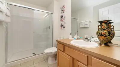 a bathroom with a sink and a shower and a toilet at MNL2696 - Windsor Hills Resort Vacation Home - includes resort clubhouse amenity access in Orlando