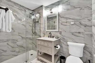 a bathroom with a shower and a sink and a toilet at AF2574 Windsor Hills Resort Vacation Home - includes resort clubhouse amenity access in Orlando