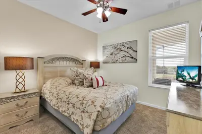 a bedroom with a bed and a ceiling fan at AF2574 Windsor Hills Resort Vacation Home - includes resort clubhouse amenity access in Orlando