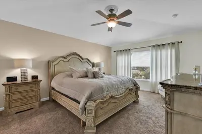 a bedroom with a bed and a ceiling fan at AF2574 Windsor Hills Resort Vacation Home - includes resort clubhouse amenity access in Orlando
