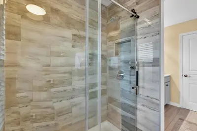 a shower with a glass door in a bathroom at AF2574-Windsor Hills Resort Vacation Home in Orlando