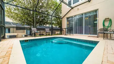 a swimming pool in front of a building at PP8114 Windsor Palms Resort Vacation Townhome in Kissimmee