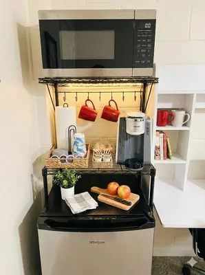 a microwave oven sitting on top of a stove at Sanford Suite King Bed Work-Ready Near Beach MCO in Sanford