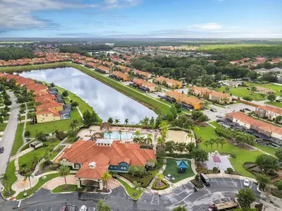an aerial view of a resort with a lake at 4 Bedrooms 5 Bathrooms Bella Vida 871Mb in Kissimmee