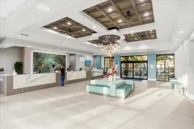 a lobby with a waiting area and a pharmacy at Resort Style Condo 4 miles from Disney in Orlando