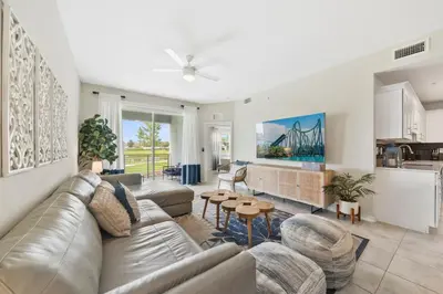 a living room with a couch and a table at 3141 Paradox Circle 101 in Kissimmee