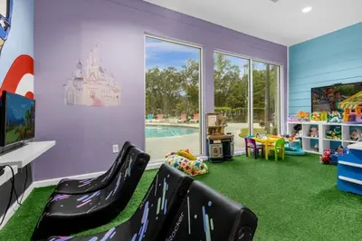 a childs play room with a castle on the wall at 4 Bedrooms 3 Bathrooms Lucaya Village 23-108 in Kissimmee