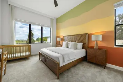 a bedroom with a bed and a large window at 15 Bedrooms 16 Bathrooms Sonoma 4151 Sb in Kissimmee