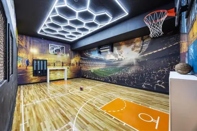 a basketball court with a mural of a game at 15 Bedrooms 16 Bathrooms Sonoma 4151 Sb in Kissimmee