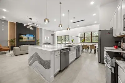 a kitchen with a large island in the middle at 15 Bedrooms 16 Bathrooms Sonoma 4151 Sb in Kissimmee