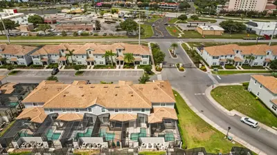 an aerial view of a suburb with houses at Summer in Style - 4 BR TownHome with Private pool in Kissimmee