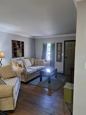 a living room with two couches and a coffee table at Epic Universal park neigbour 1500 feet in Orlando