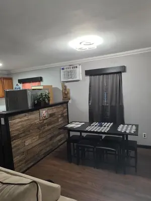 a dining room with a table and chairs in a room at Epic Universal park neigbour 1500 feet in Orlando