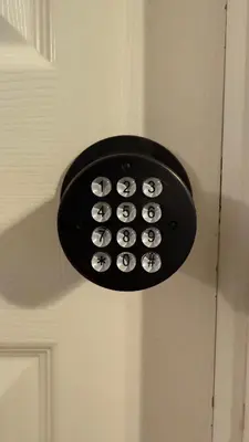a light on a door with a bunch of buttons at L12 Private Room with Smart TV Near Everything in Orlando