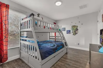 a bedroom with a bunk bed with a ladder at 6 Bedrooms - 5,5 Bathrooms - Bella Vida 4529Ss in Kissimmee