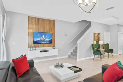 a living room with a couch and a table at 4824 Resort Pool House Disney Universal Orlando in Kissimmee