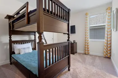 a bedroom with a wooden bunk bed with a bunk bedouble at 361 Pendant ct in Orlando