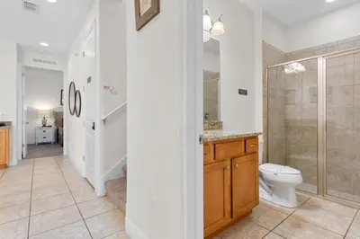 a bathroom with a toilet and a walk in shower at 361 Pendant ct in Orlando