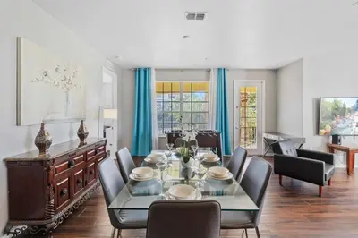 a dining room with a table and chairs at 5049 Ultimate Orlando retreat at Vista Cay 203 in Orlando